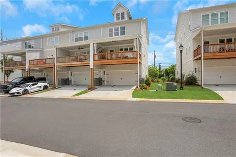 a view of building with car parked