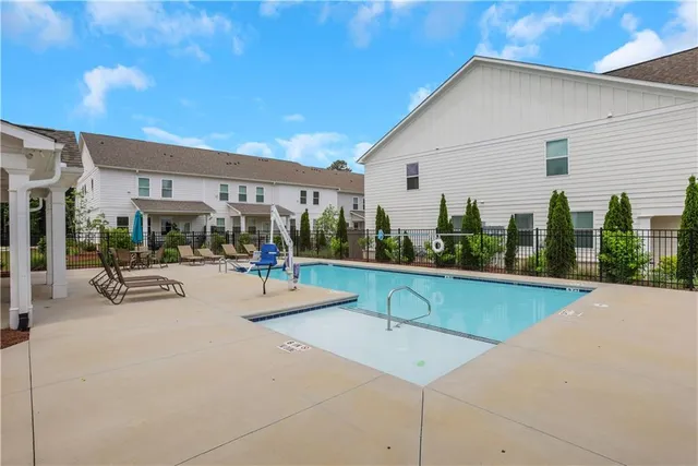 a view of a patio with swimming pool
