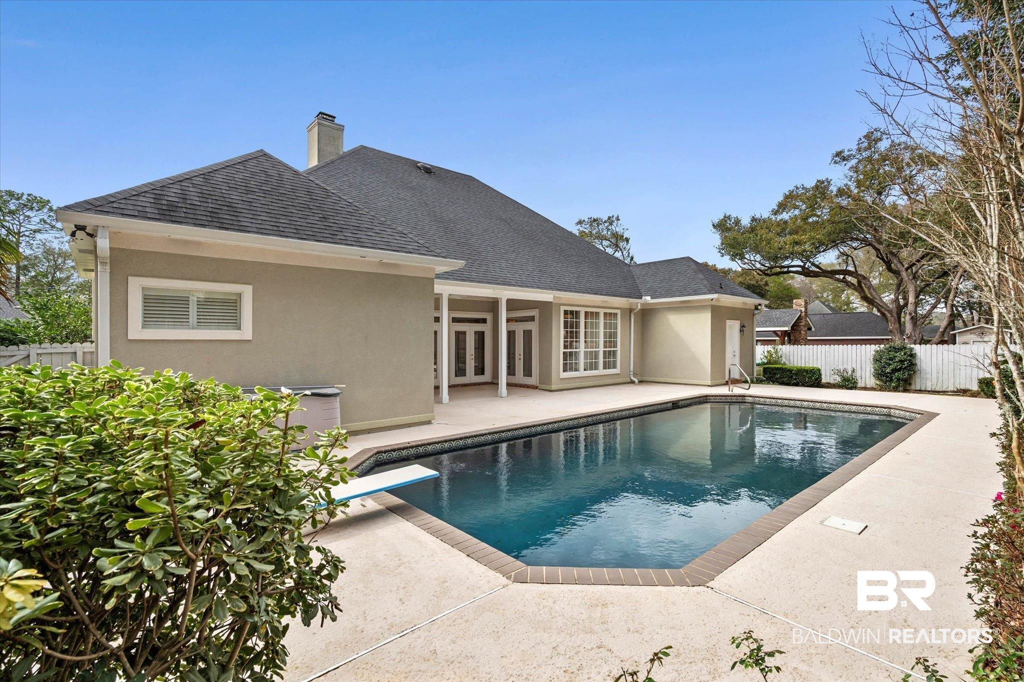 1083 Southern Way Court Mobile, AL 36609 - Photo 28 of 31 View of swimming pool featuring patio surround, french doors, and a diving board