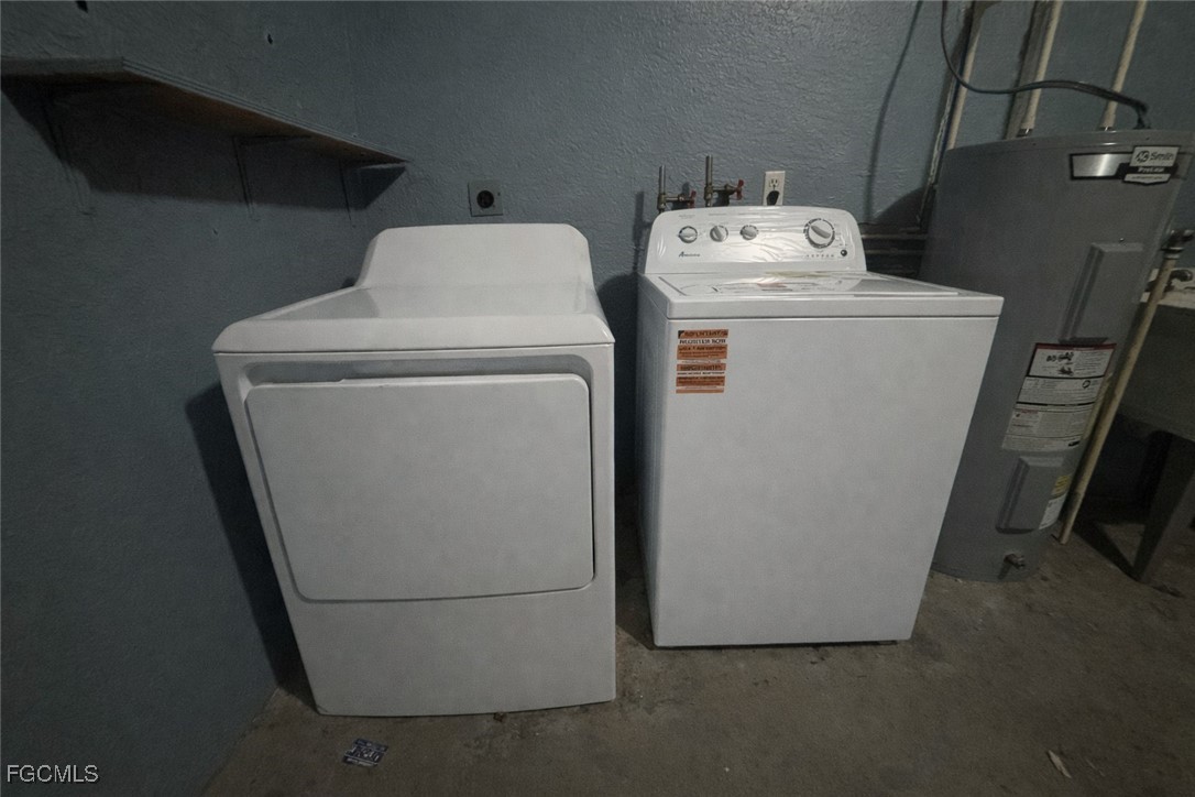 5014 26th Street Southwest Lehigh Acres, FL 33973 - Photo 19 of 20 a utility room with dryer and washer