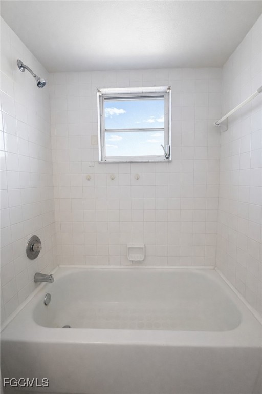 5014 26th Street Southwest Lehigh Acres, FL 33973 - Photo 10 of 20 a bathroom with a tub