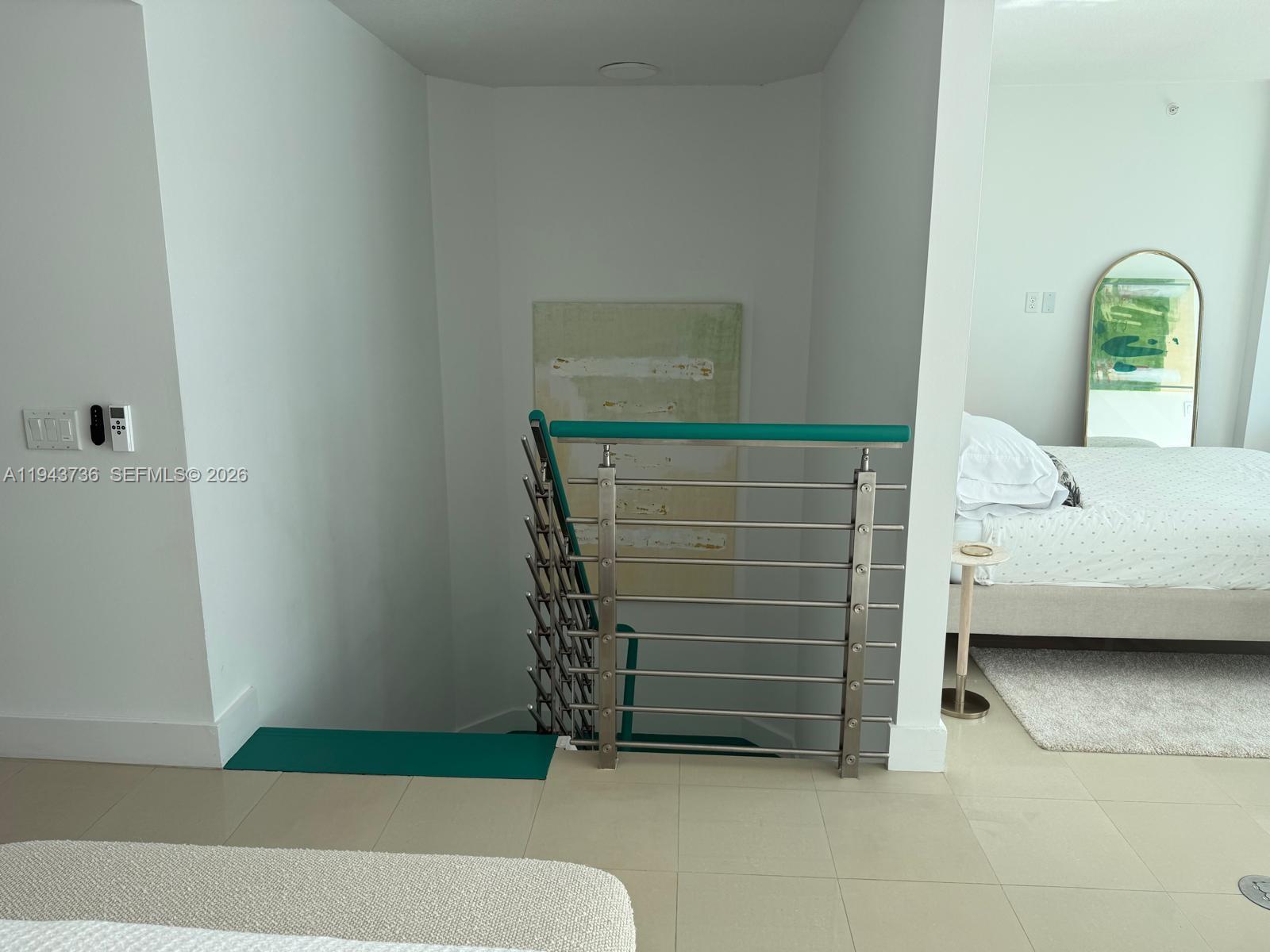 41 Southeast 5th Street, Unit 2010 Miami, FL 33131 - Photo 17 of 58 a bedroom with a bed and a window