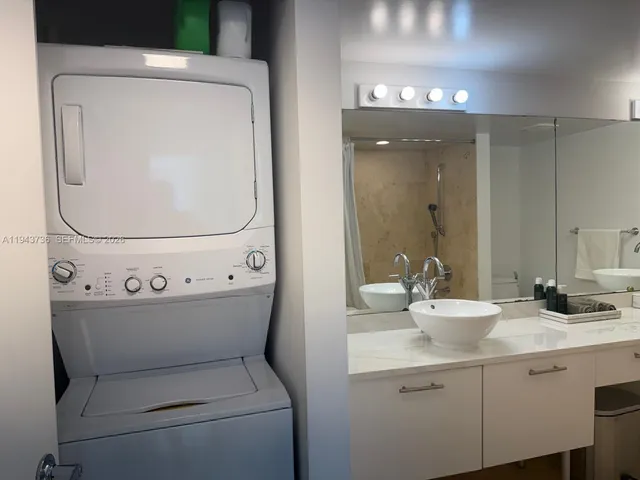 a white toilet sitting next to a bath tub