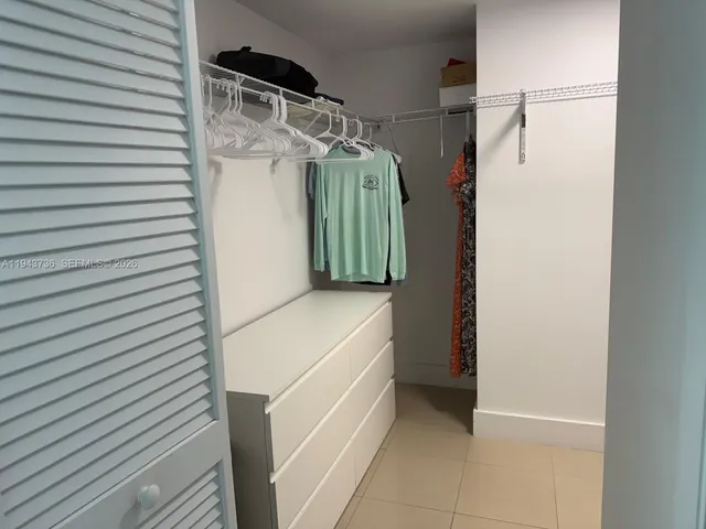 a kitchen with a table and chairs in it