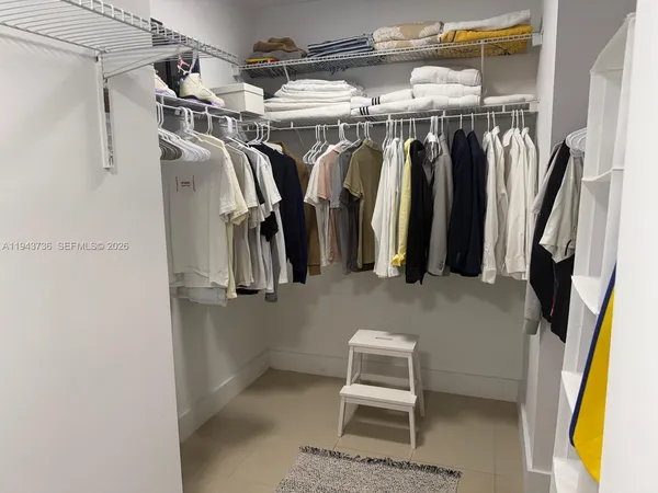 a kitchen with a sink and stainless steel appliances