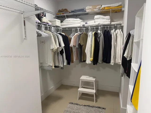 a kitchen with a sink and stainless steel appliances