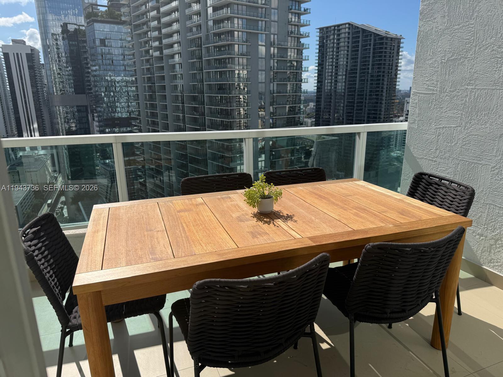 41 Southeast 5th Street, Unit 2010 Miami, FL 33131 - Photo 42 of 58 a view of a dining room with furniture