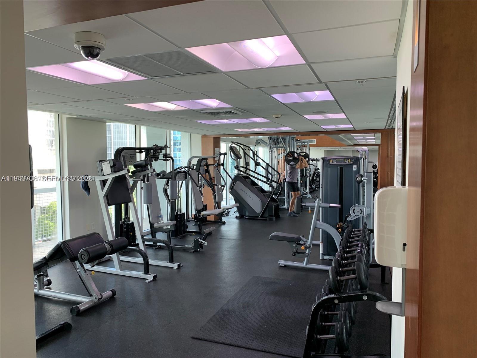 41 Southeast 5th Street, Unit 2010 Miami, FL 33131 - Photo 54 of 58 a view of a room with gym equipment