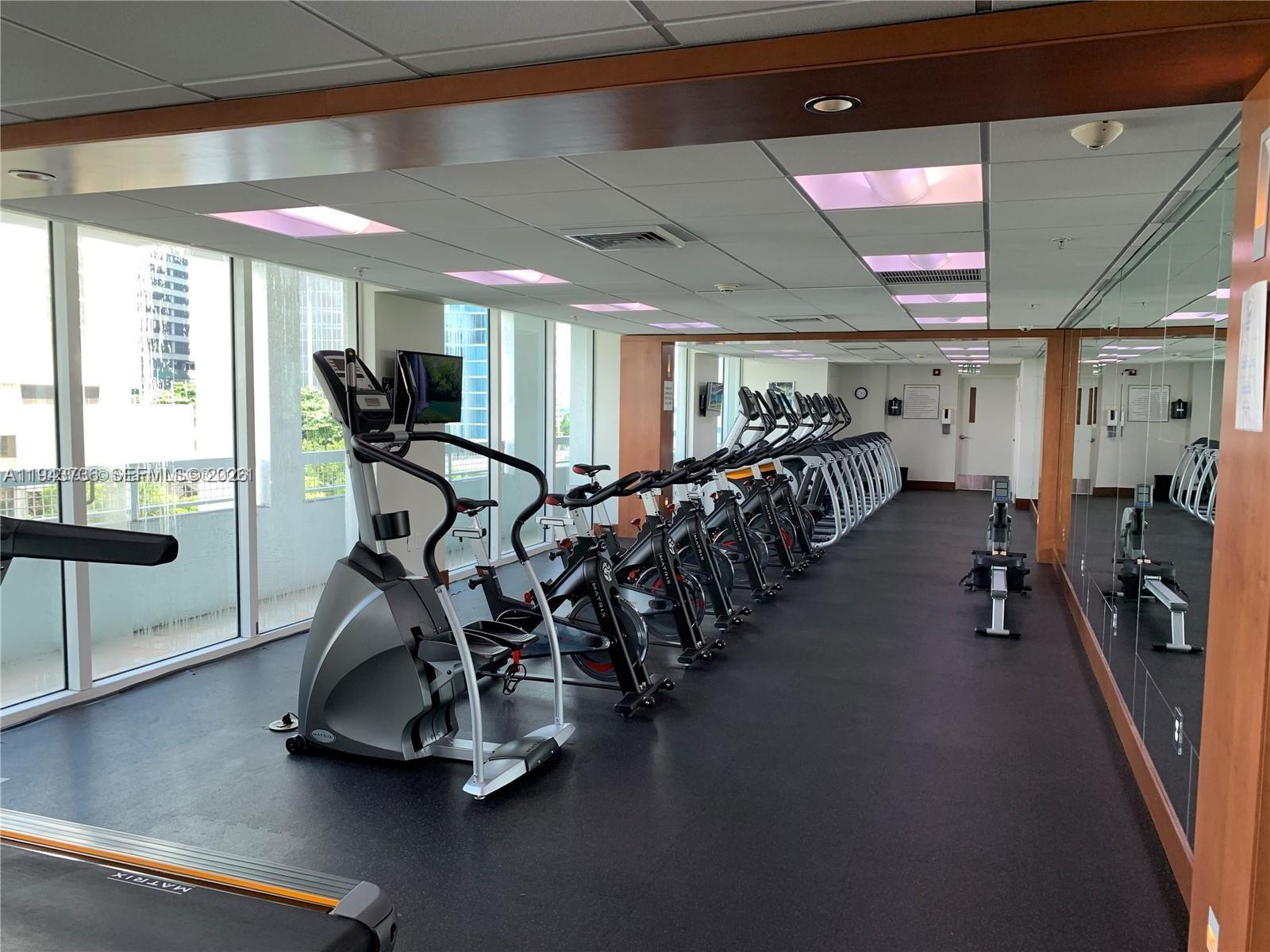 41 Southeast 5th Street, Unit 2010 Miami, FL 33131 - Photo 55 of 58 a view of a room with gym equipment