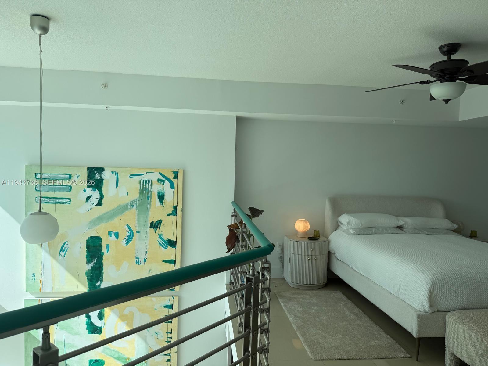 41 Southeast 5th Street, Unit 2010 Miami, FL 33131 - Photo 7 of 58 a bedroom with a bed and a window