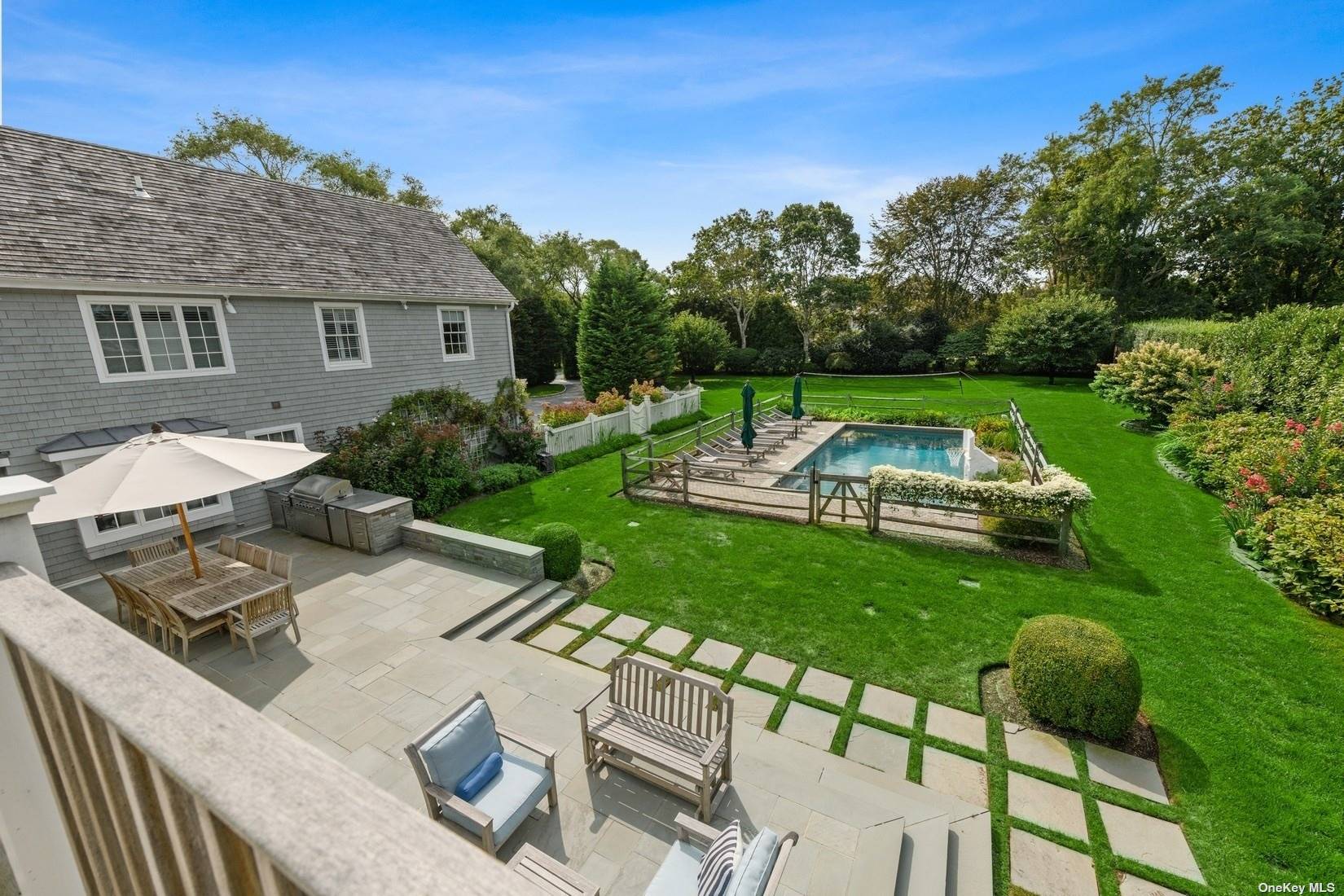 a view of backyard of house with outdoor seating