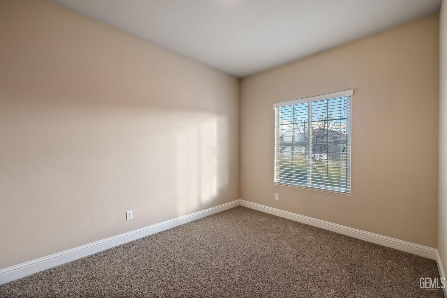 Undisclosed Address Shafter, CA 93263 - Photo 11 of 50 an empty room with a window