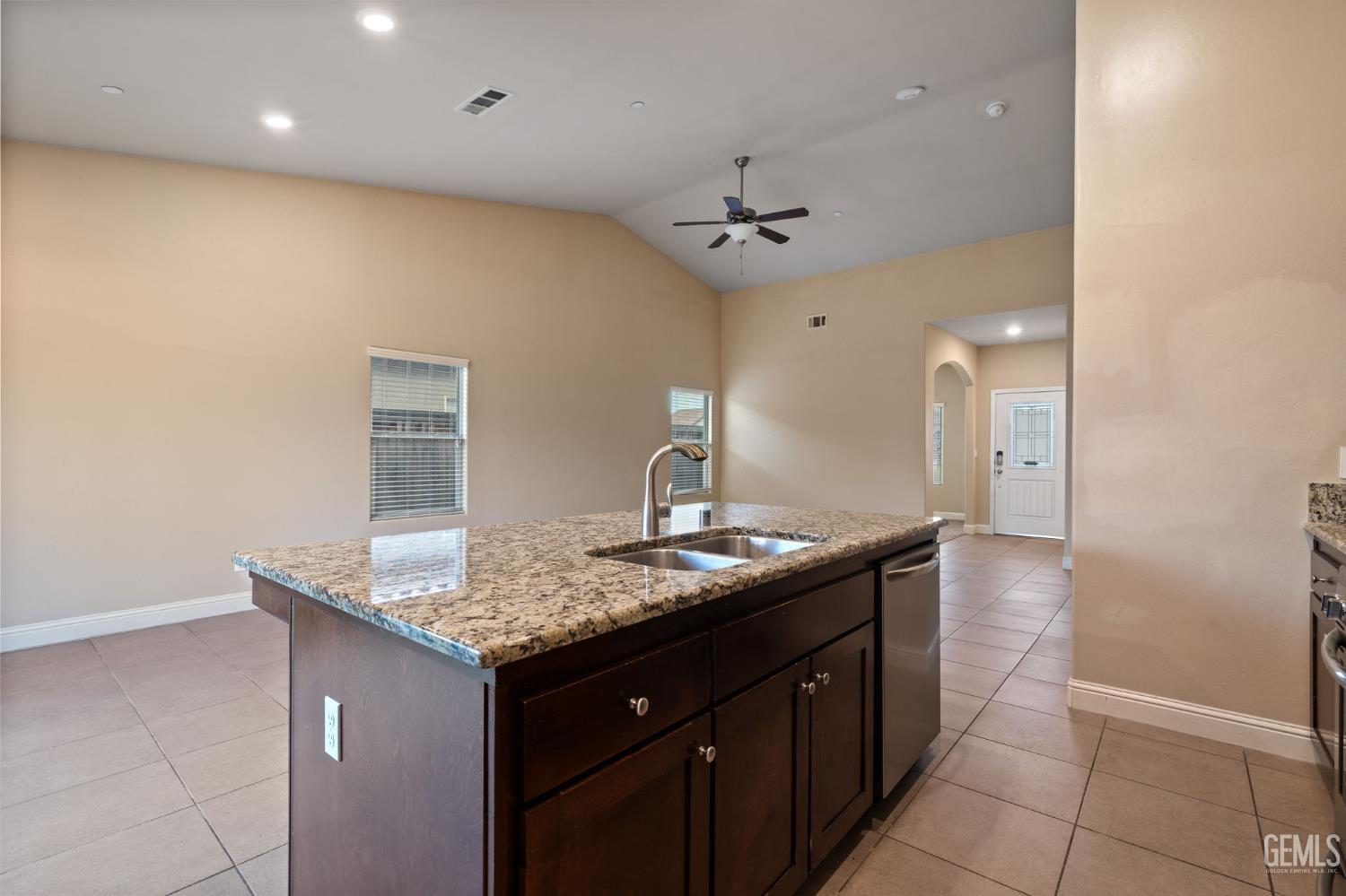 Undisclosed Address Shafter, CA 93263 - Photo 28 of 50 a bathroom with a granite countertop sink a toilet and a mirror