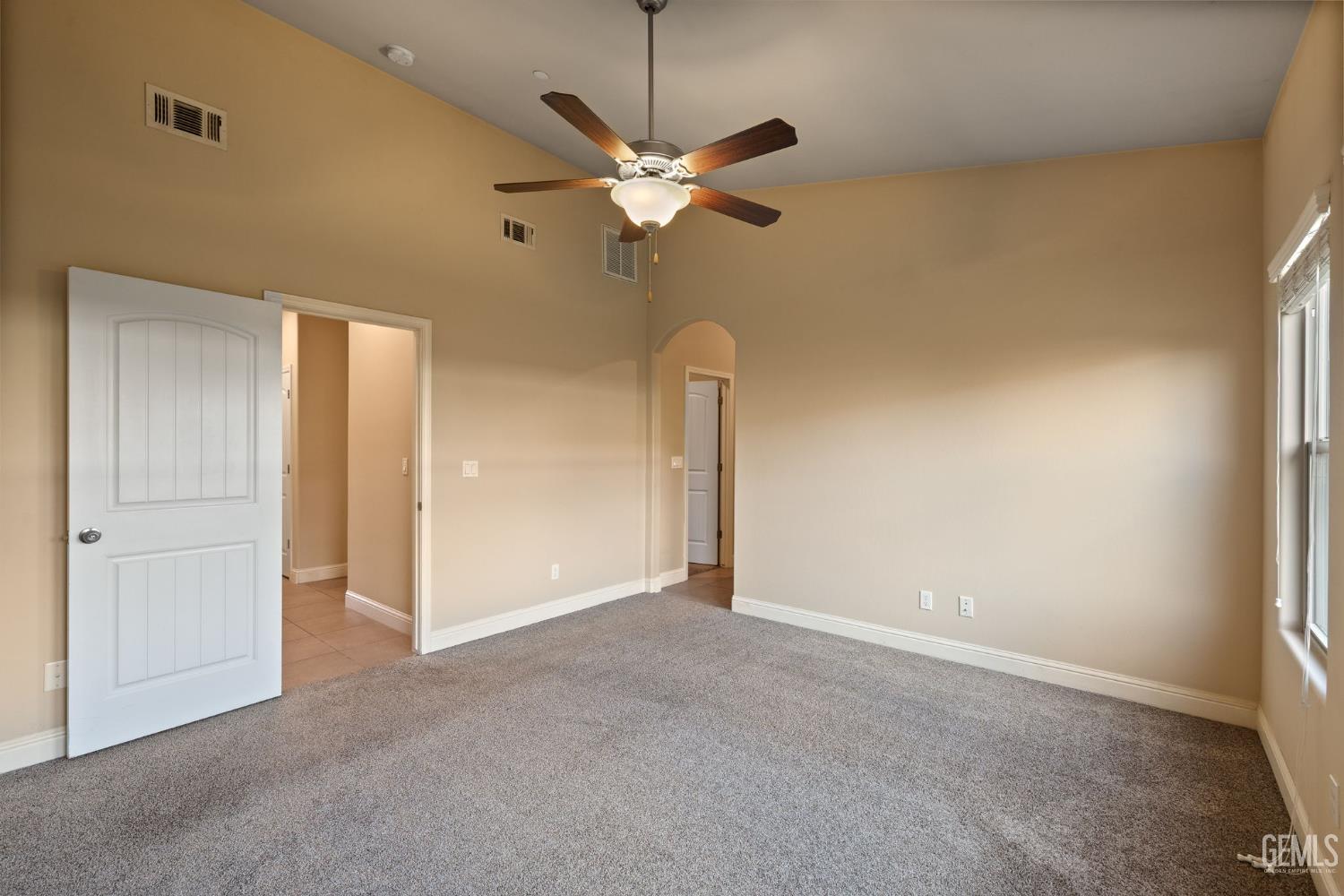 Undisclosed Address Shafter, CA 93263 - Photo 33 of 50 a view of a room with a ceiling fan and a window