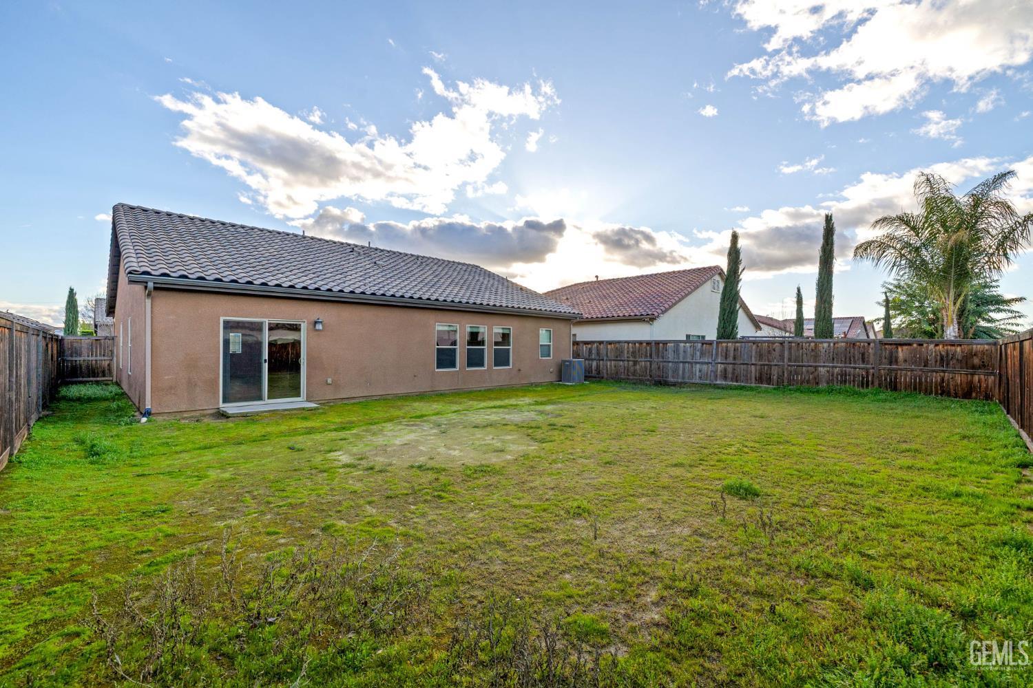 Undisclosed Address Shafter, CA 93263 - Photo 43 of 50 a view of a house with a backyard