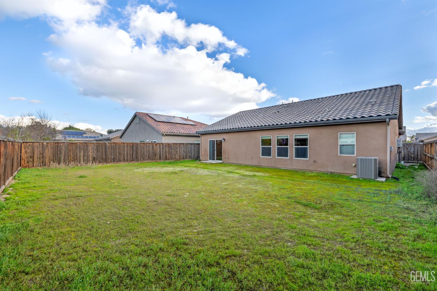 Undisclosed Address Shafter, CA 93263 - Photo 50 of 50 a front view of house with yard and green space