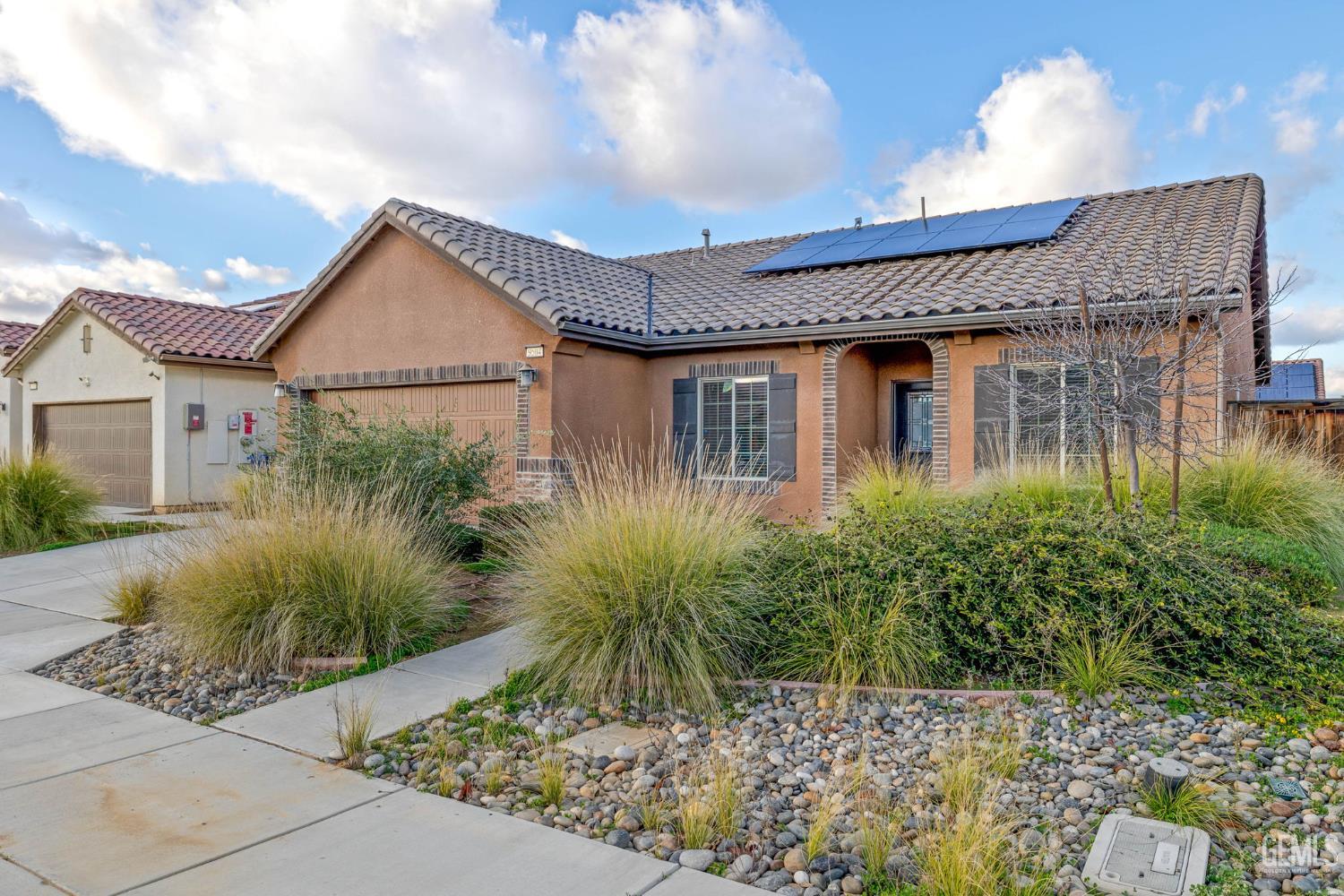 Undisclosed Address Shafter, CA 93263 - Photo 6 of 50 a front view of a house with garden