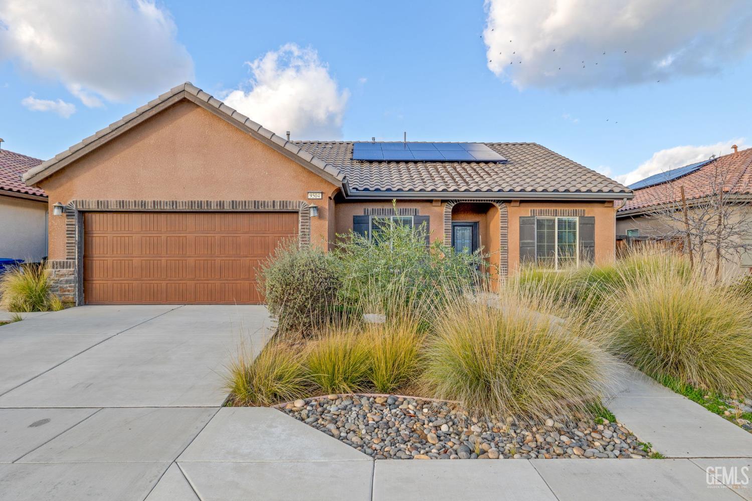 Undisclosed Address Shafter, CA 93263 - Photo 7 of 50 a front view of a house with a yard