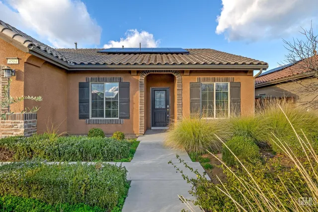 a view of a building with potted plants