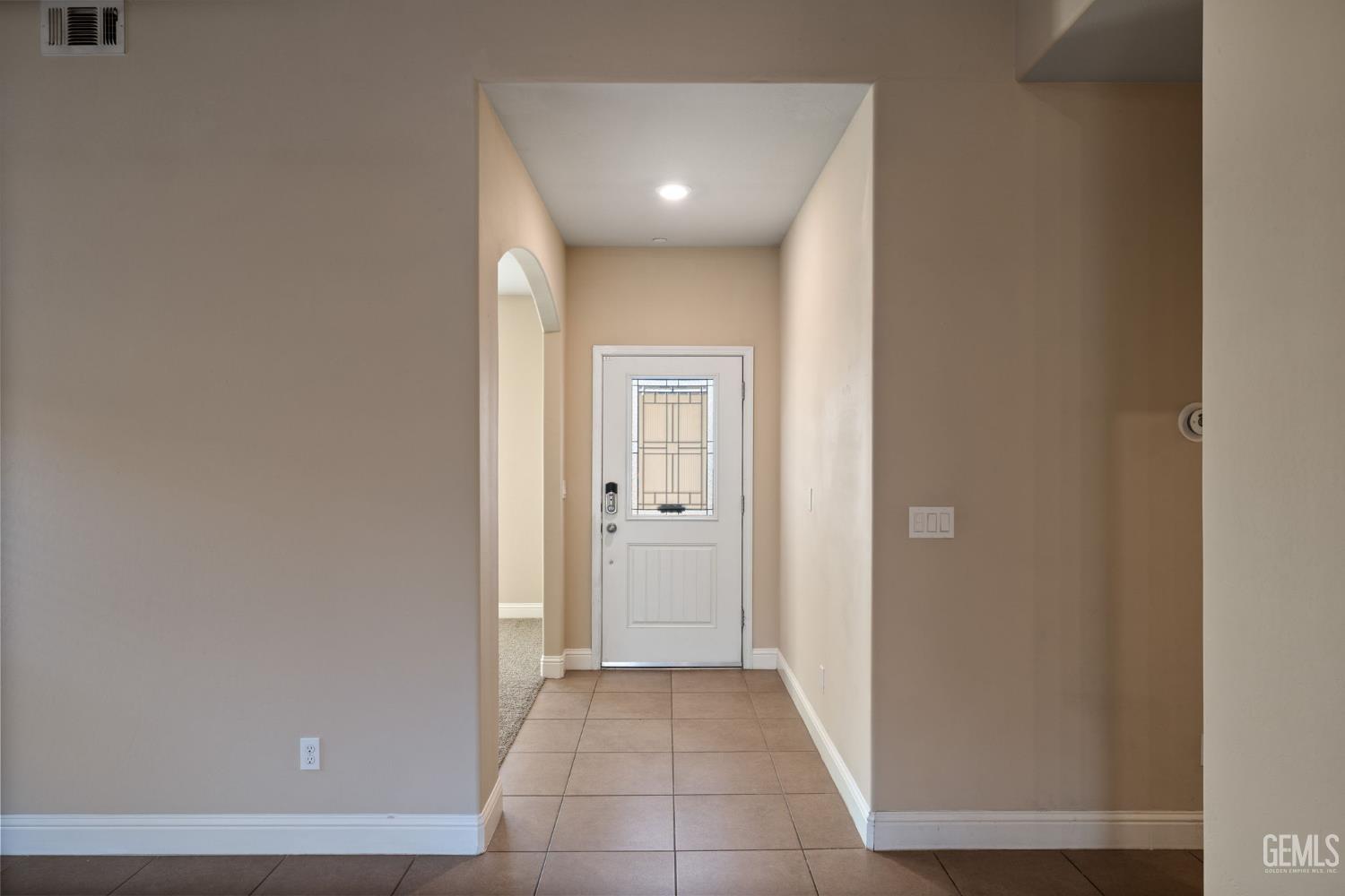 Undisclosed Address Shafter, CA 93263 - Photo 10 of 50 a view of a hallway with wooden floor
