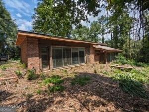 1835 Upper River Road Macon, GA 31211 - Photo 2 of 3 a front view of a house with garden