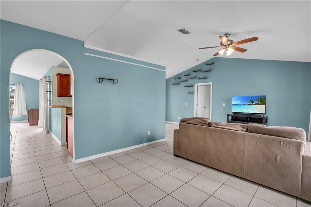 18447 Fuchsia Road Fort Myers, FL 33967 - Photo 10 of 43 a living room with furniture and a flat screen tv