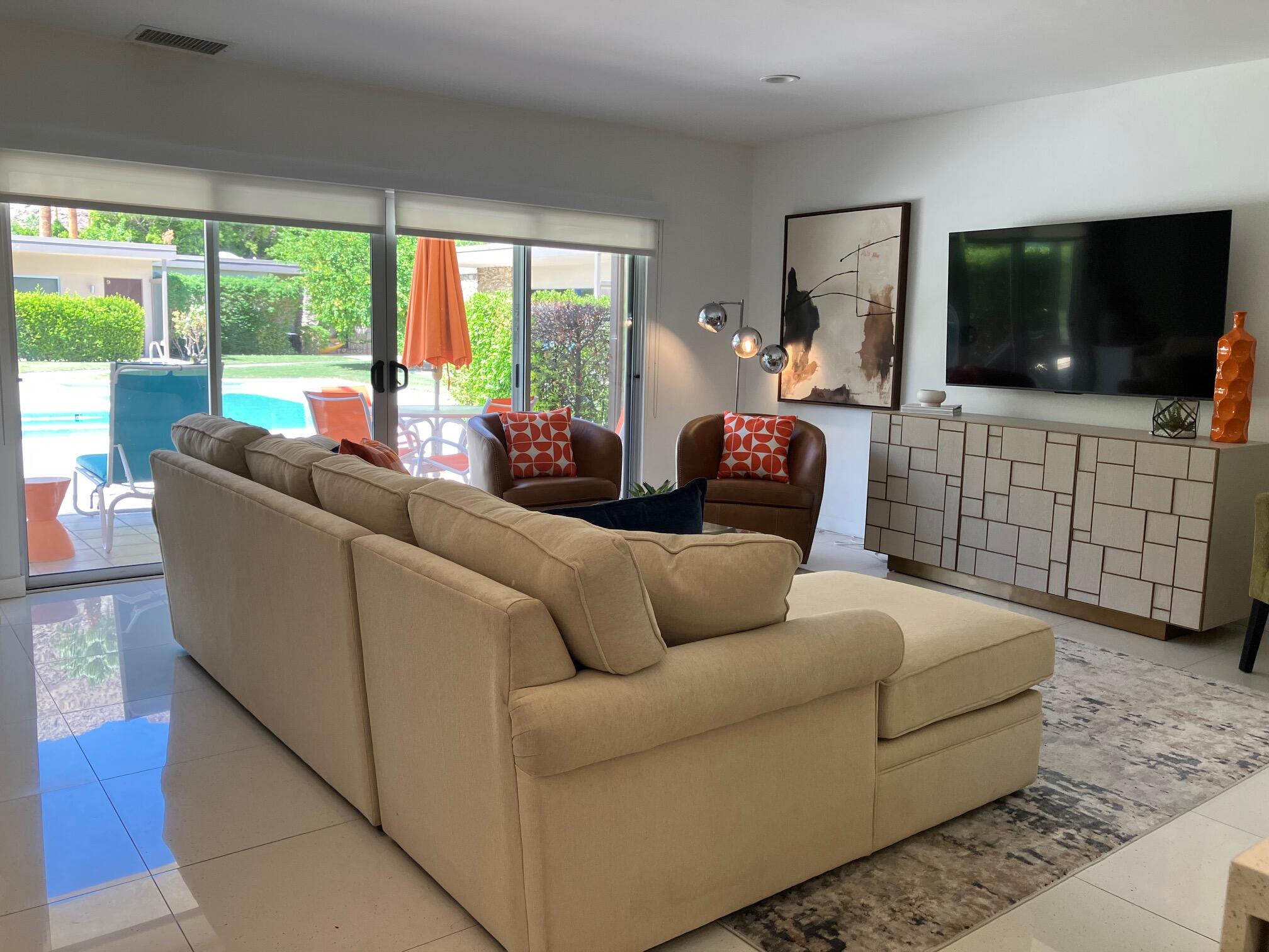 500 West Arenas Road, Unit 2 Palm Springs, CA 92262 - Photo 15 of 36 a living room with furniture and a flat screen tv