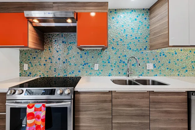 a kitchen with a stove and a sink
