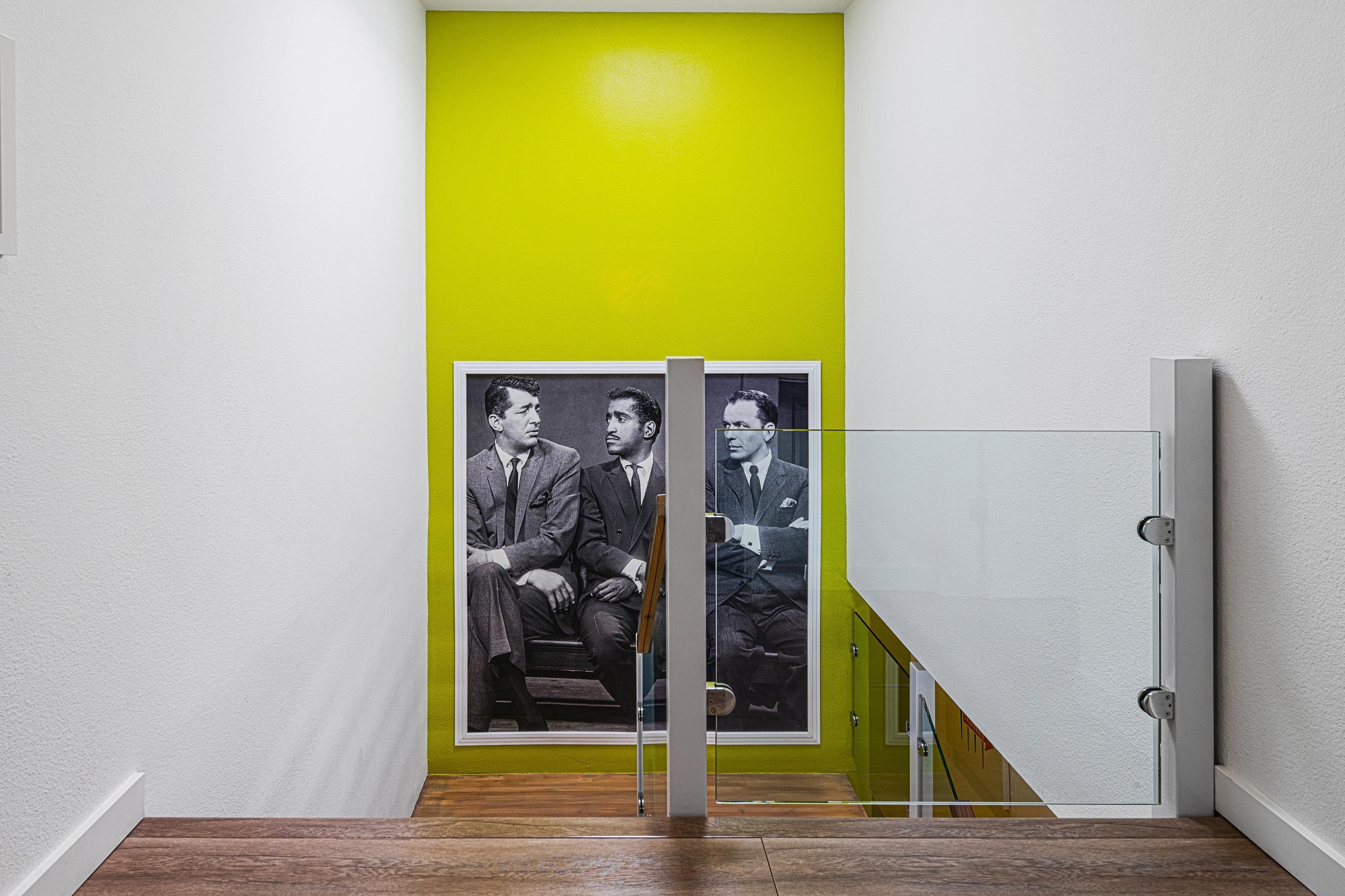 500 West Arenas Road, Unit 2 Palm Springs, CA 92262 - Photo 24 of 36 a view of a hallway with a dining area and a bathroom