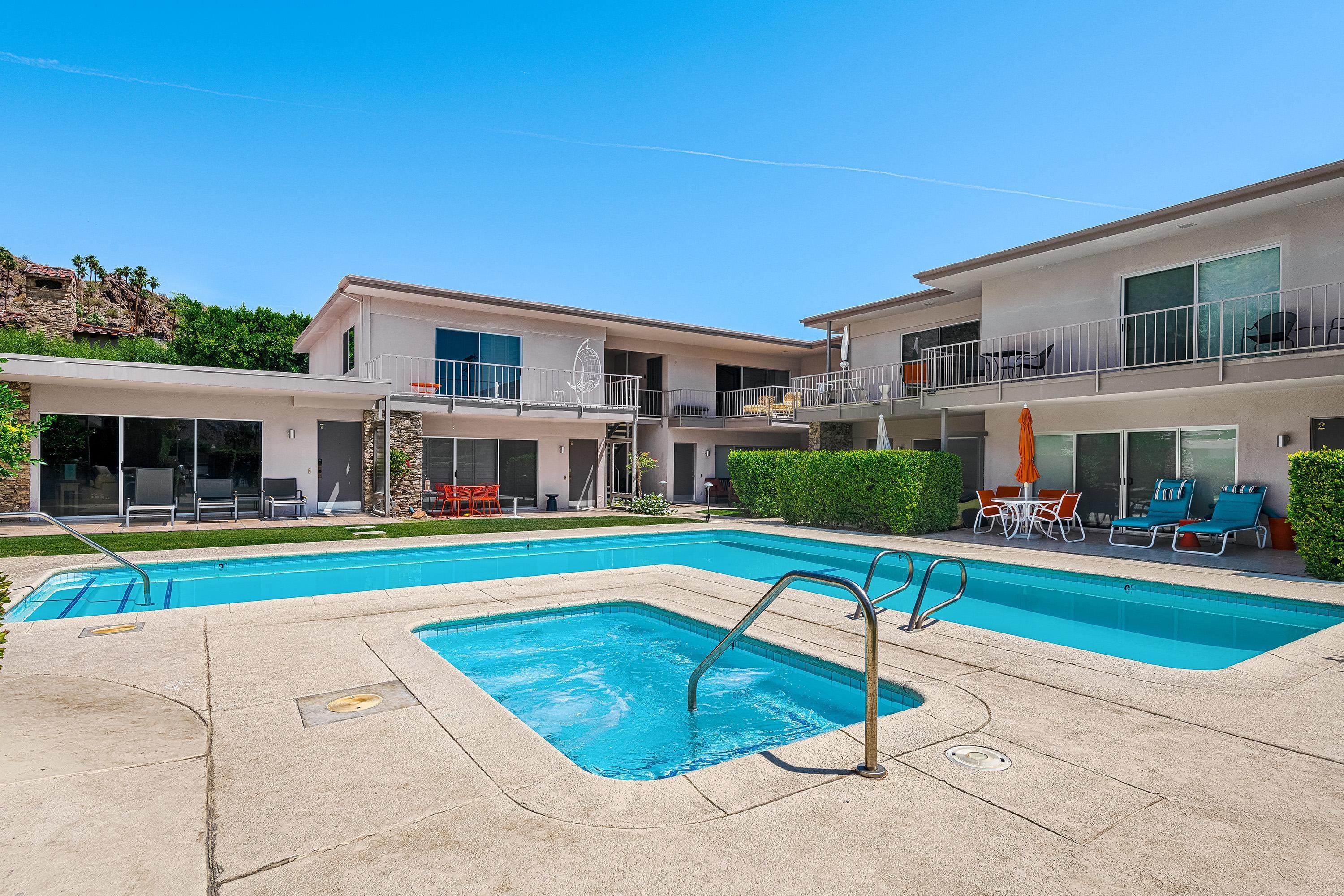 500 West Arenas Road, Unit 2 Palm Springs, CA 92262 - Photo 31 of 36 a house with swimming pool in front of it