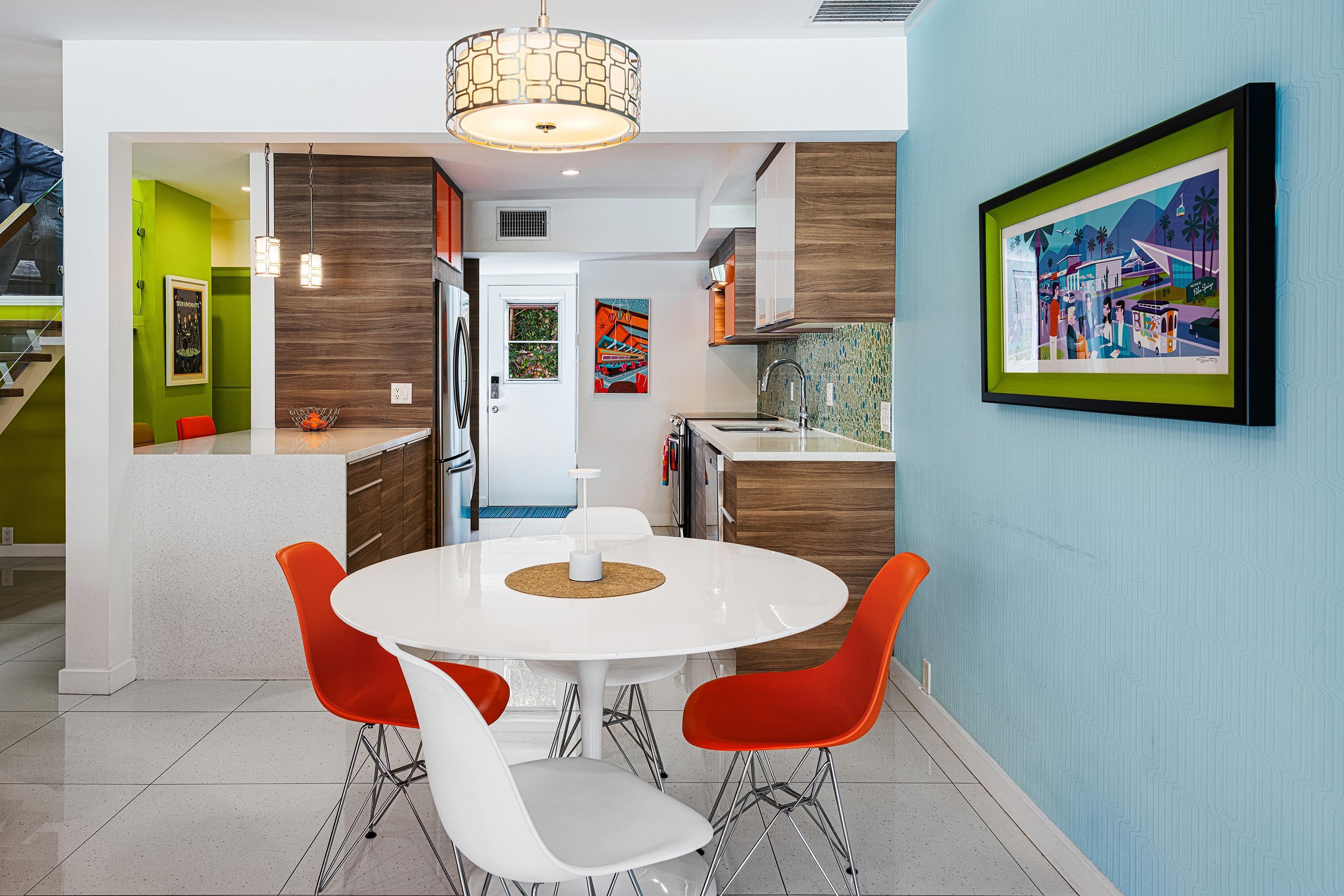 500 West Arenas Road, Unit 2 Palm Springs, CA 92262 - Photo 6 of 36 a view of a dining room with furniture and wooden floor