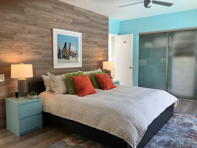 a bedroom with a bed and a couch