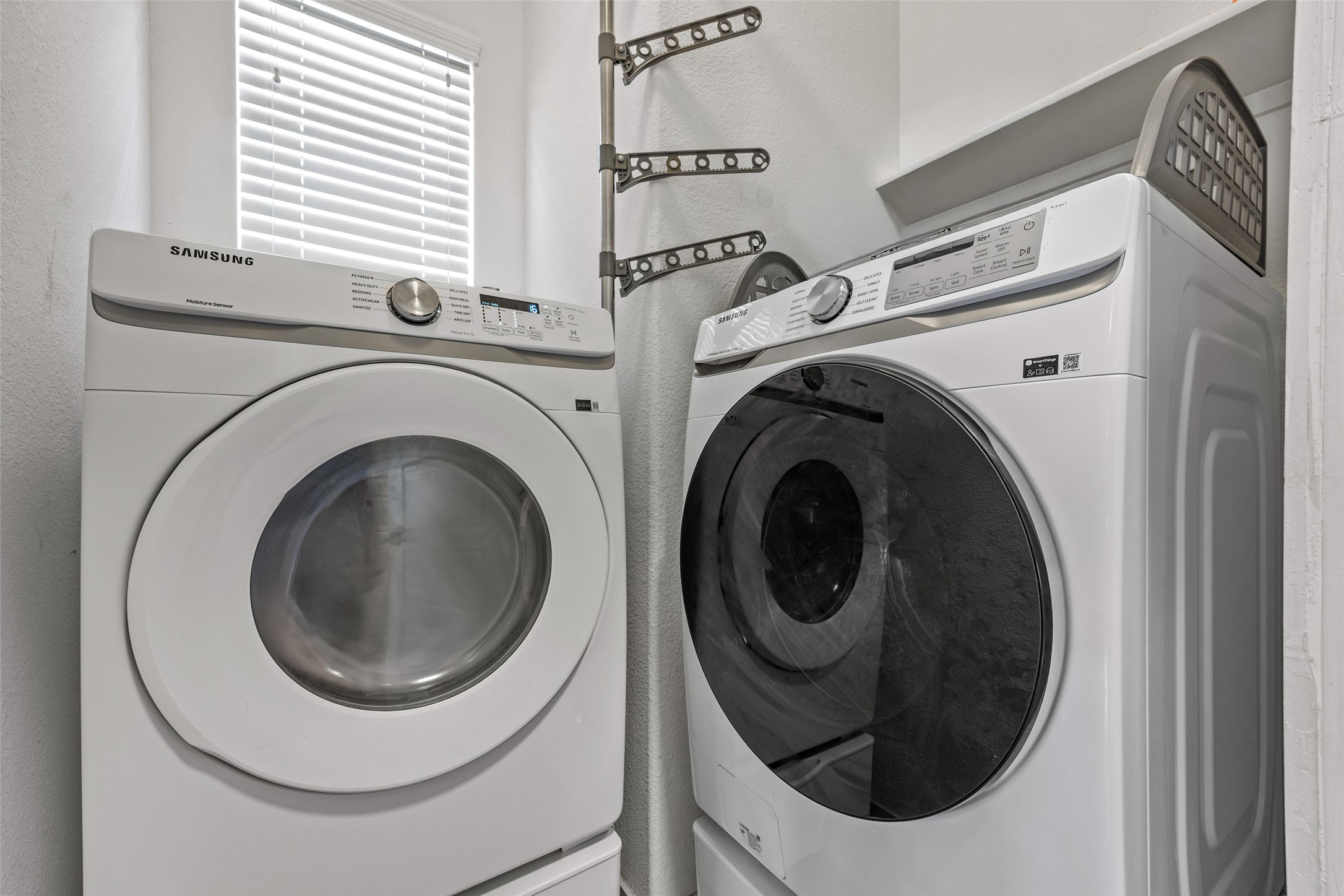 1408 Homespun Road Austin, TX 78745 - Photo 11 of 20 A well-equipped laundry space with modern washer and dryer units, ready for daily tasks.