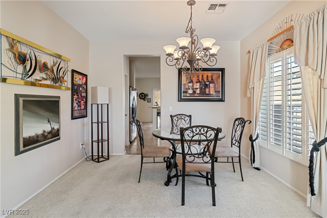 2078 Willow Bay Road Laughlin, NV 89029 - Photo 12 of 99 Dining area with carpet and a chandelier