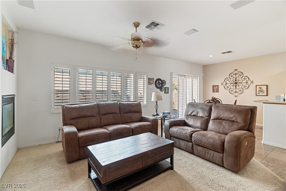2078 Willow Bay Road Laughlin, NV 89029 - Photo 21 of 99 Family Room with ceiling fan, a glass covered fireplace, and recessed lighting