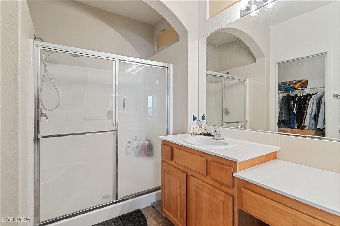 2078 Willow Bay Road Laughlin, NV 89029 - Photo 37 of 99 Full Primary bathroom with a shower stall, vanity, and a spacious closet