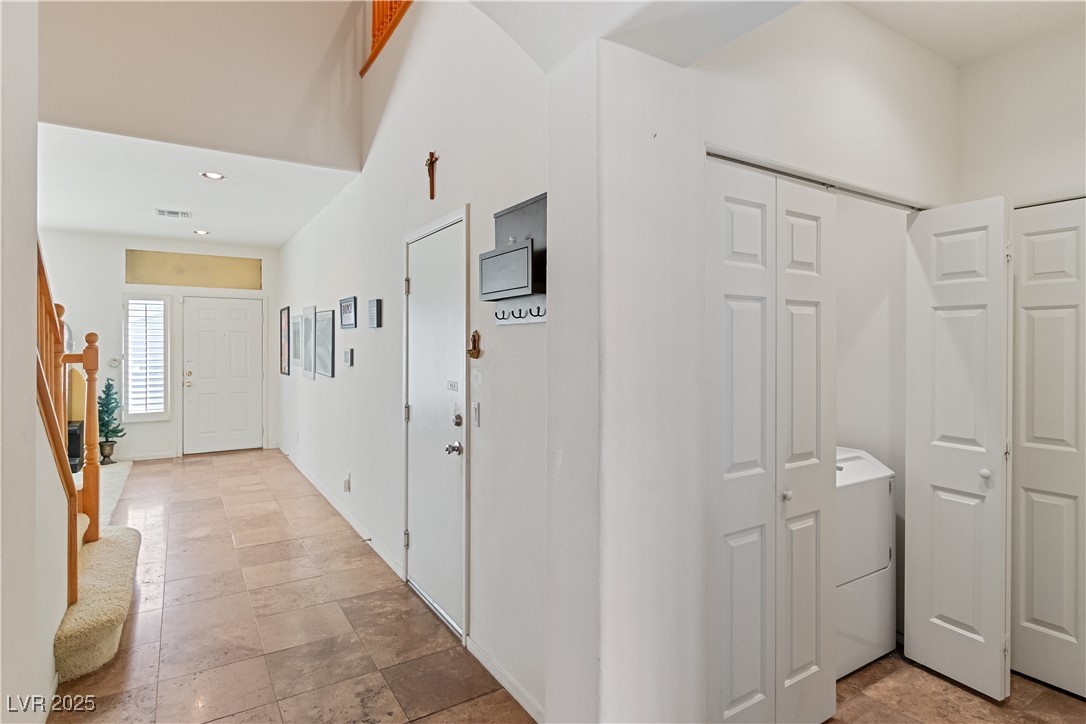 2078 Willow Bay Road Laughlin, NV 89029 - Photo 40 of 99 Corridor featuring stairway, recessed lighting, washer / dryer, and light tile flooring
