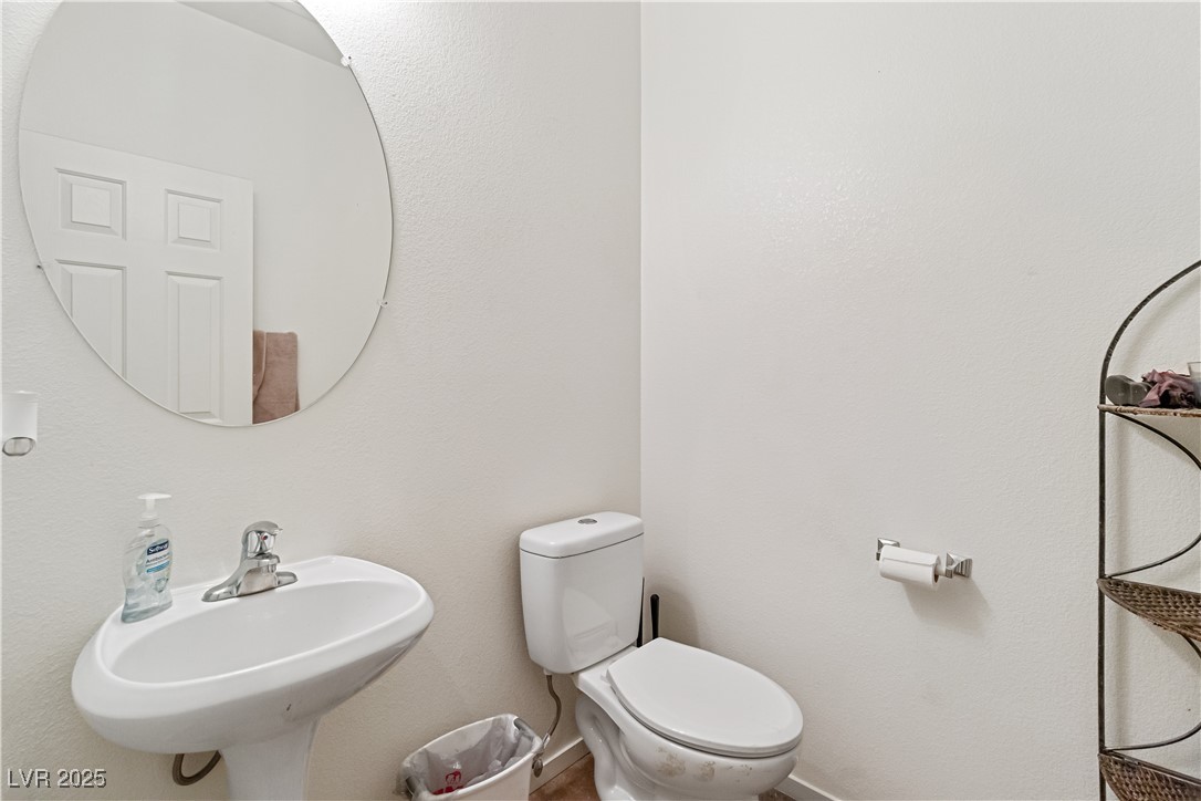 2078 Willow Bay Road Laughlin, NV 89029 - Photo 42 of 99 Half Bathroom with toilet and a textured wall located downstairs
