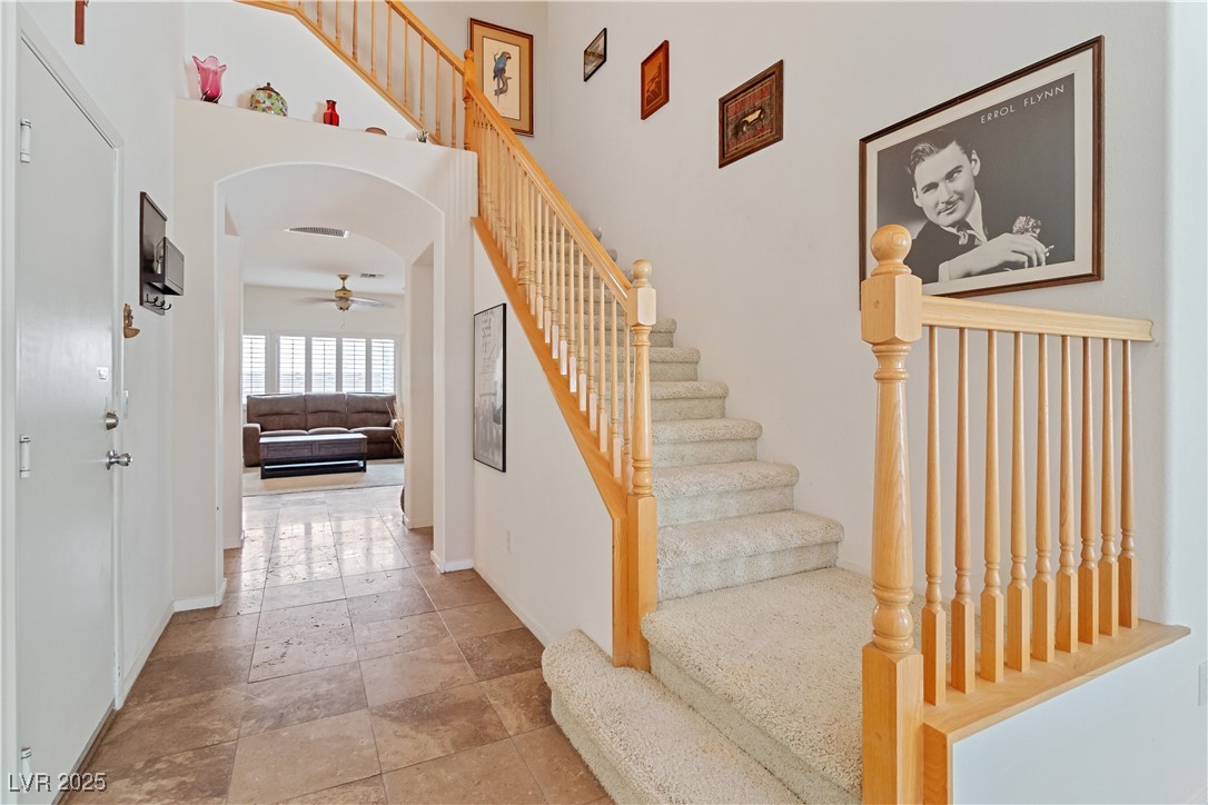 2078 Willow Bay Road Laughlin, NV 89029 - Photo 43 of 99 Stairway featuring baseboards and a towering ceiling