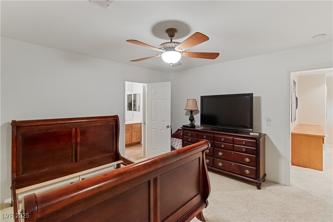 2078 Willow Bay Road Laughlin, NV 89029 - Photo 47 of 99 Second Bedroom featuring light carpet, ceiling fan, and ensuite bathroom