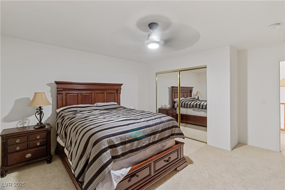 2078 Willow Bay Road Laughlin, NV 89029 - Photo 50 of 99 Third Bedroom featuring light carpet, a ceiling fan, and a closet