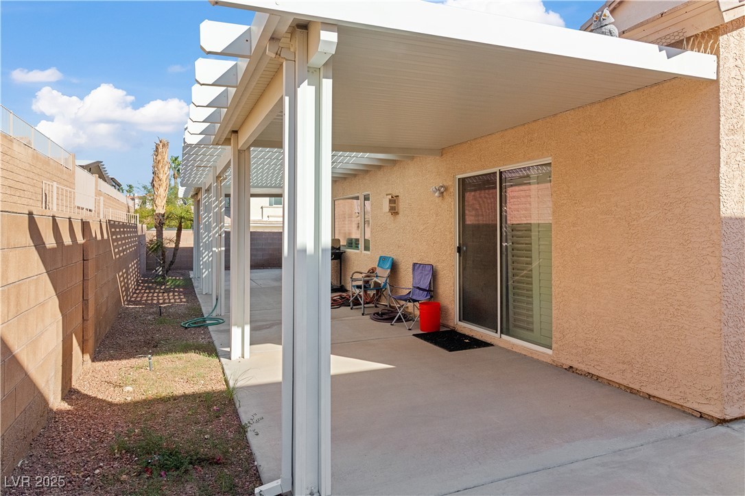 2078 Willow Bay Road Laughlin, NV 89029 - Photo 68 of 99 Fenced backyard with a patio area and a pergola