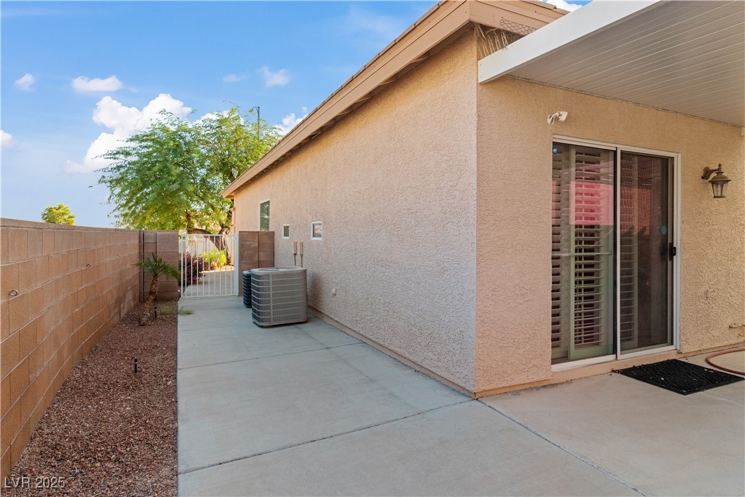 2078 Willow Bay Road Laughlin, NV 89029 - Photo 76 of 99 View of side of property with stucco siding, a patio, and a gate