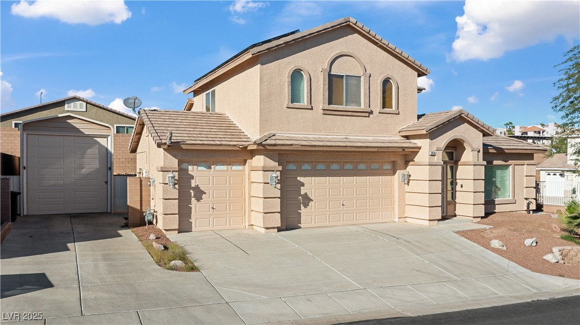 2078 Willow Bay Road Laughlin, NV 89029 - Photo 79 of 99 Mediterranean / spanish home featuring stucco siding, a tiled roof, and concrete driveway