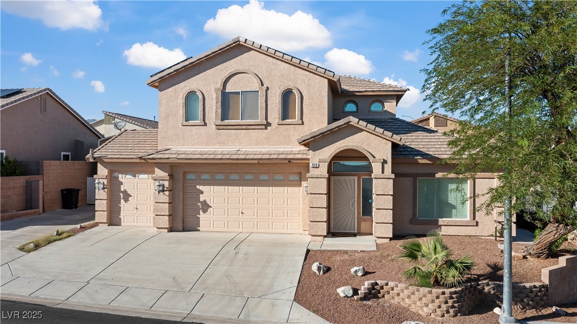 2078 Willow Bay Road Laughlin, NV 89029 - Photo 81 of 99 Mediterranean / spanish-style home with stucco siding, driveway, a tiled roof, and a garage