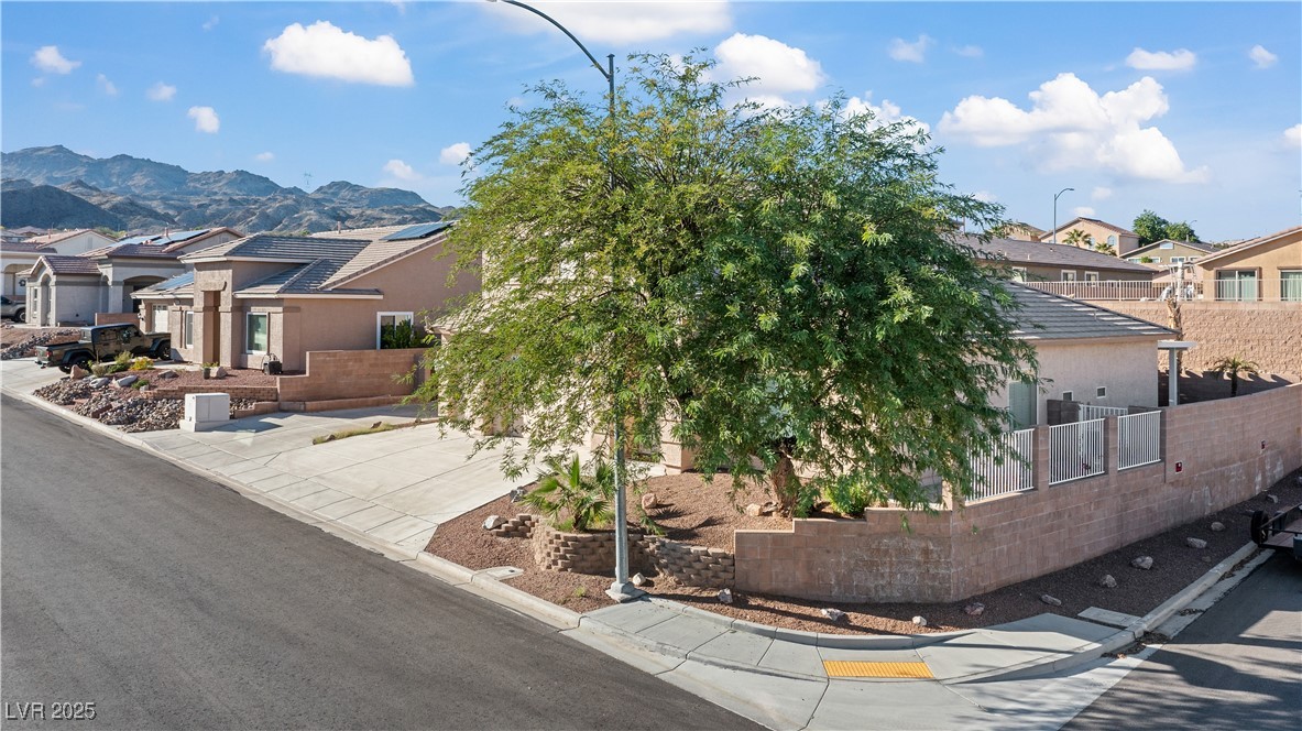 2078 Willow Bay Road Laughlin, NV 89029 - Photo 83 of 99 View of front of house featuring a residential view, stucco siding, and a mountain view