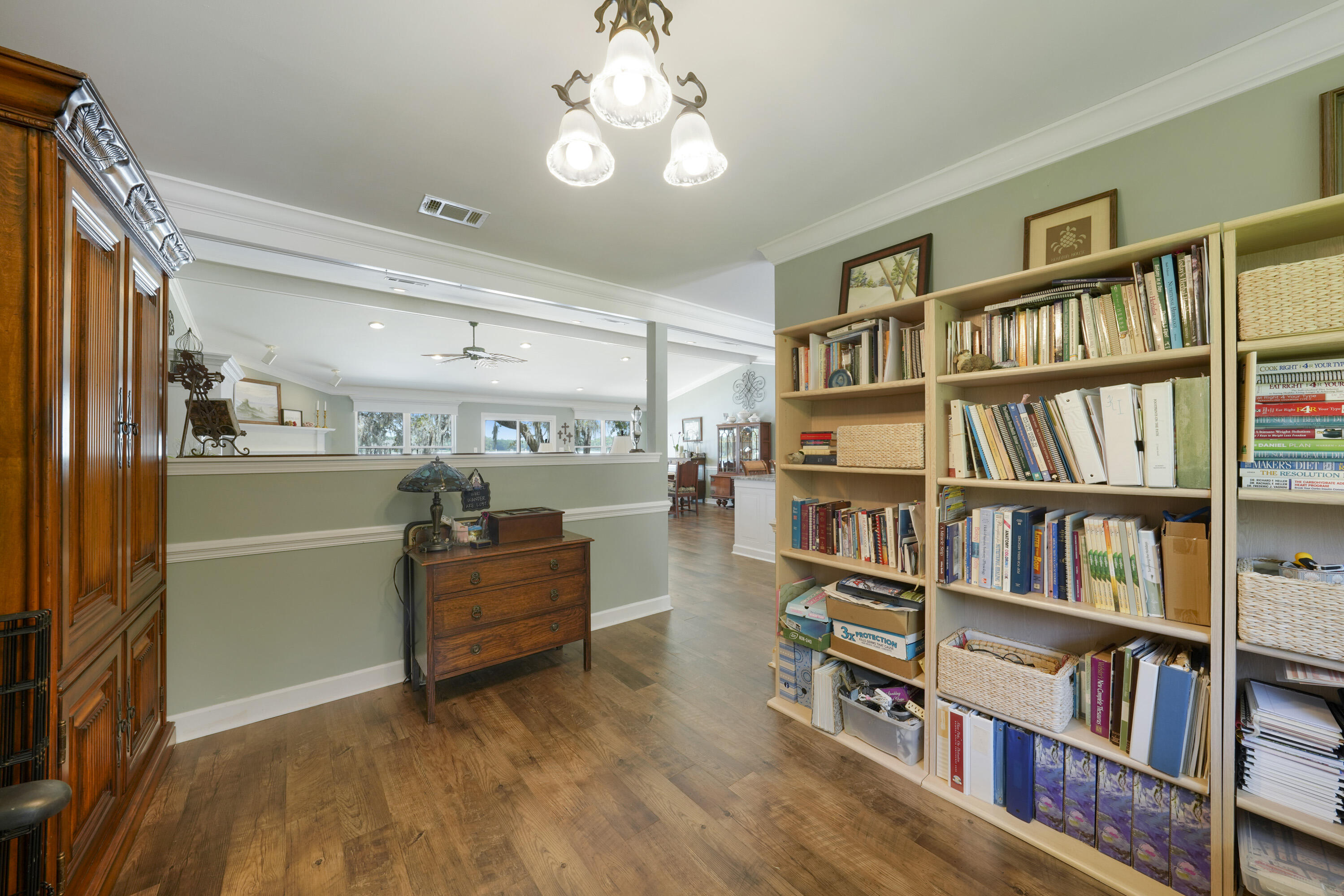 94 George Ellis Point Road Freeport, FL 32439 - Photo 11 of 63 a living room with furniture and a book shelf