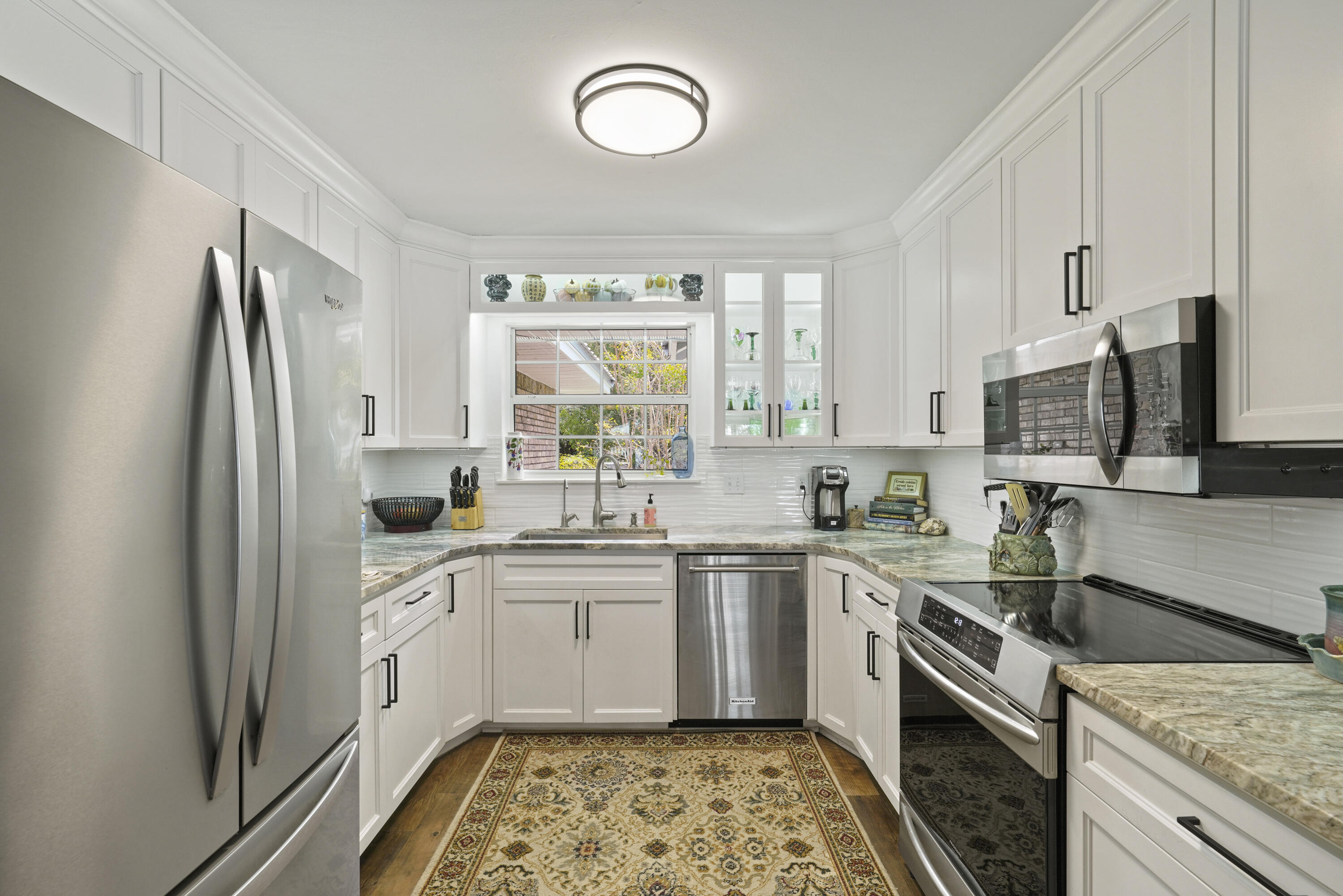 94 George Ellis Point Road Freeport, FL 32439 - Photo 13 of 63 a kitchen with a sink stove and refrigerator