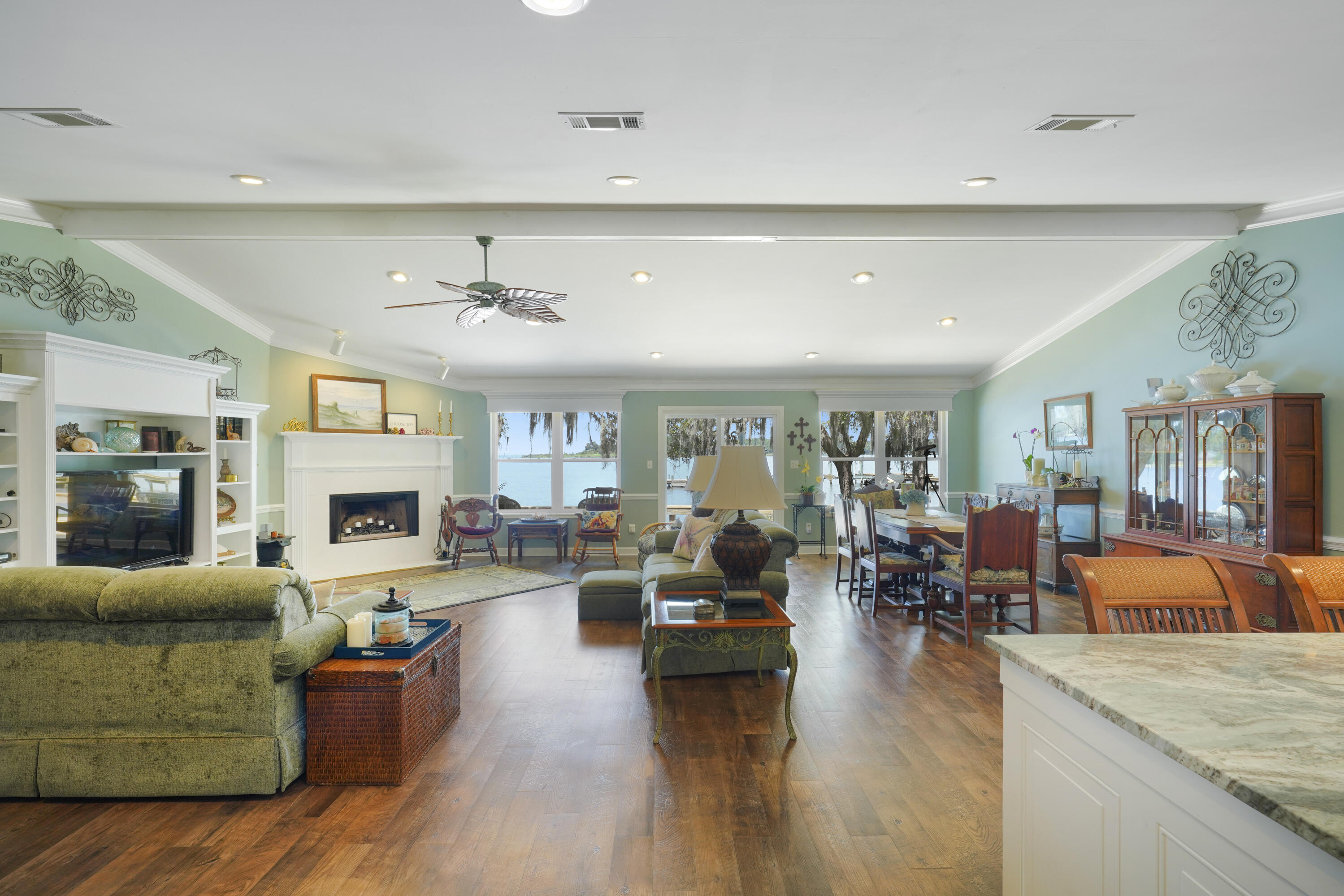 94 George Ellis Point Road Freeport, FL 32439 - Photo 20 of 63 a living room with fireplace furniture and a wooden floor