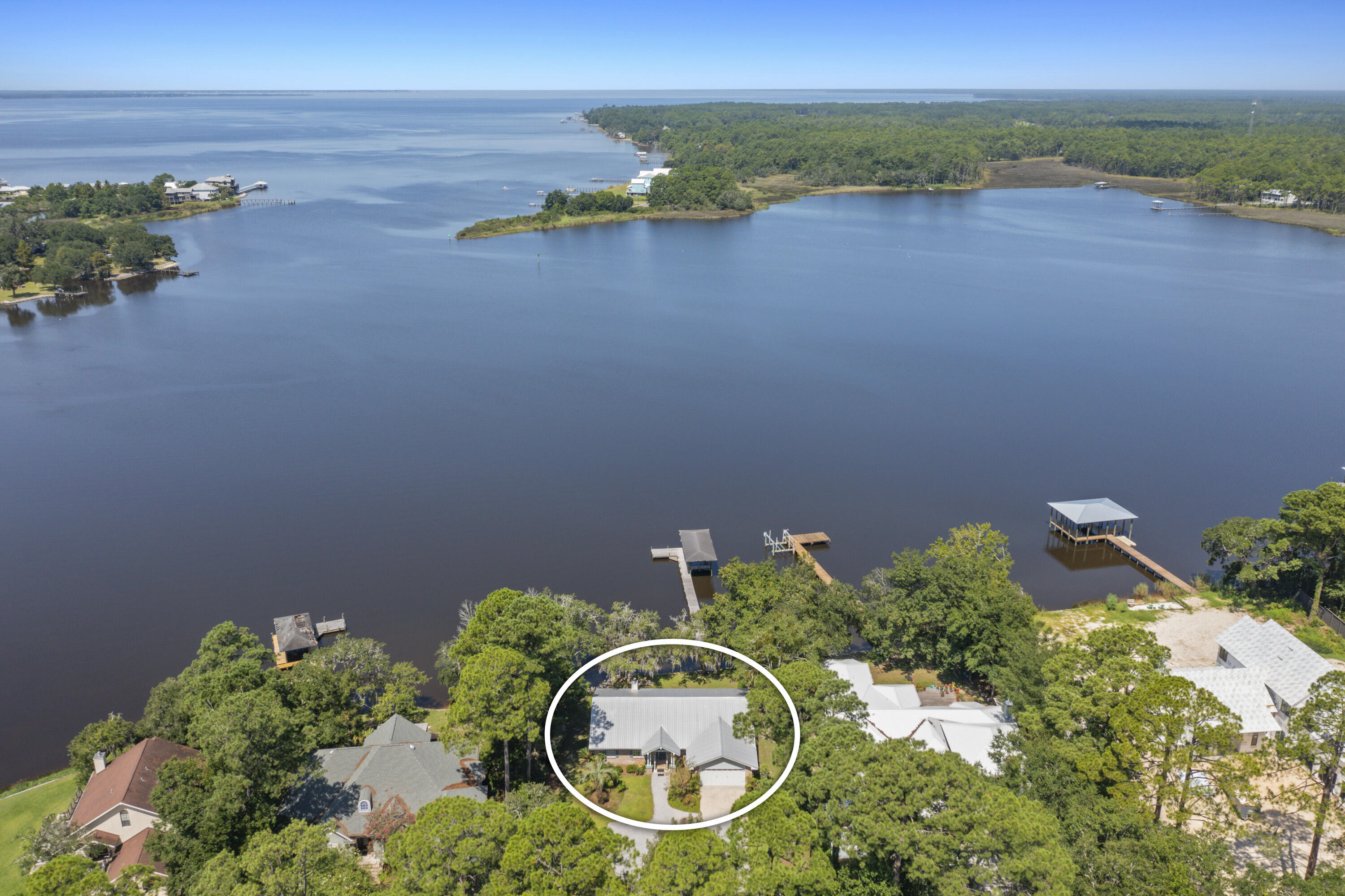 94 George Ellis Point Road Freeport, FL 32439 - Photo 2 of 63 an aerial view of a house with garden space and lake view
